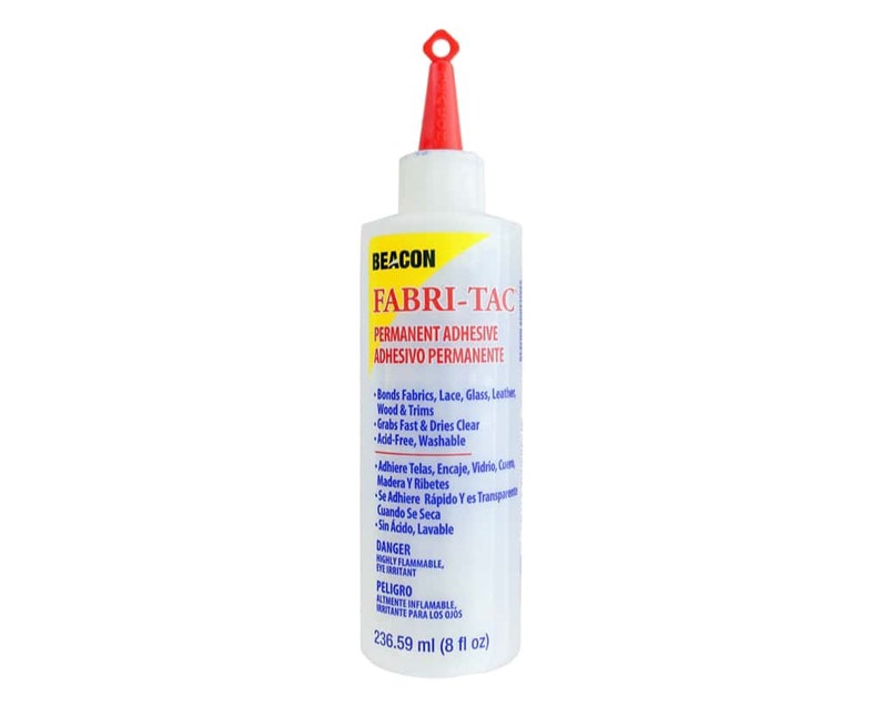 May include: A clear plastic bottle of Beacon Fabri-Tac permanent adhesive. The bottle is labeled with the product name and instructions in both English and Spanish. The bottle is 8 fluid ounces (236.59 ml).