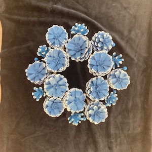 Brush painted natural pine cones wreath in blue and light grey color.
