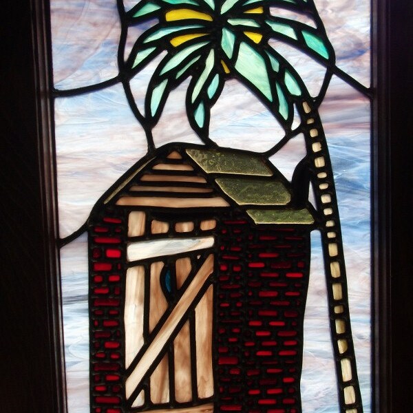 Caribbean outhouse.Original leaded stain glass.