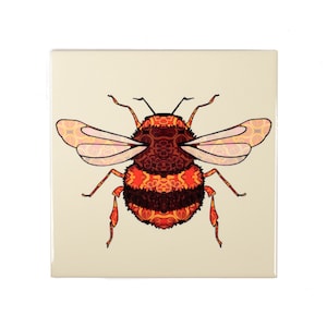 May include: A ceramic tile featuring a colourful illustration of a bumblebee. The bumblebee is orange, red and black with intricate patterns on its body and wings.