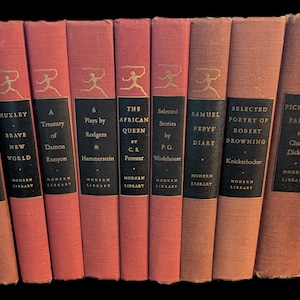 May include: A collection of vintage books with red spines and black title blocks. Gold lettering and a running figure adorn the spines. Titles include "Brave New World," "The African Queen," and "Pickwick Papers."