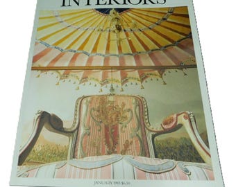 May include: The World of Interiors magazine cover from January 1993, featuring a striped, pink and yellow tent-like ceiling with a chandelier hanging from it. A pink and white striped armchair with ornate gold detailing is in the foreground.