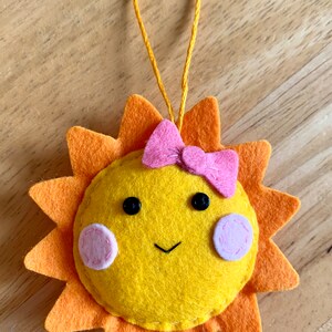 Handmade felt sunshine decoration. Summer decoration. Sunshine. Summertime. Sun with pink bow