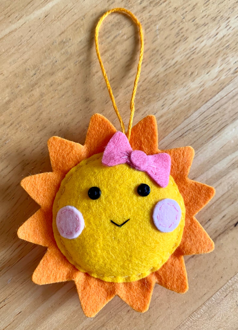 Handmade felt sunshine decoration. Summer decoration. Sunshine. Summertime. Sun with pink bow