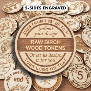May include: A collection of circular raw birch wood tokens featuring laser-engraved text and designs. The central token displays the text 2-SIDES ENGRAVED, SIZES FROM 1.25 INCHES UP TO 3 INCHES, Submit your design, RAW BIRCH WOOD TOKENS, Or let us design it for you, YOUR LOGO OR TEXT.