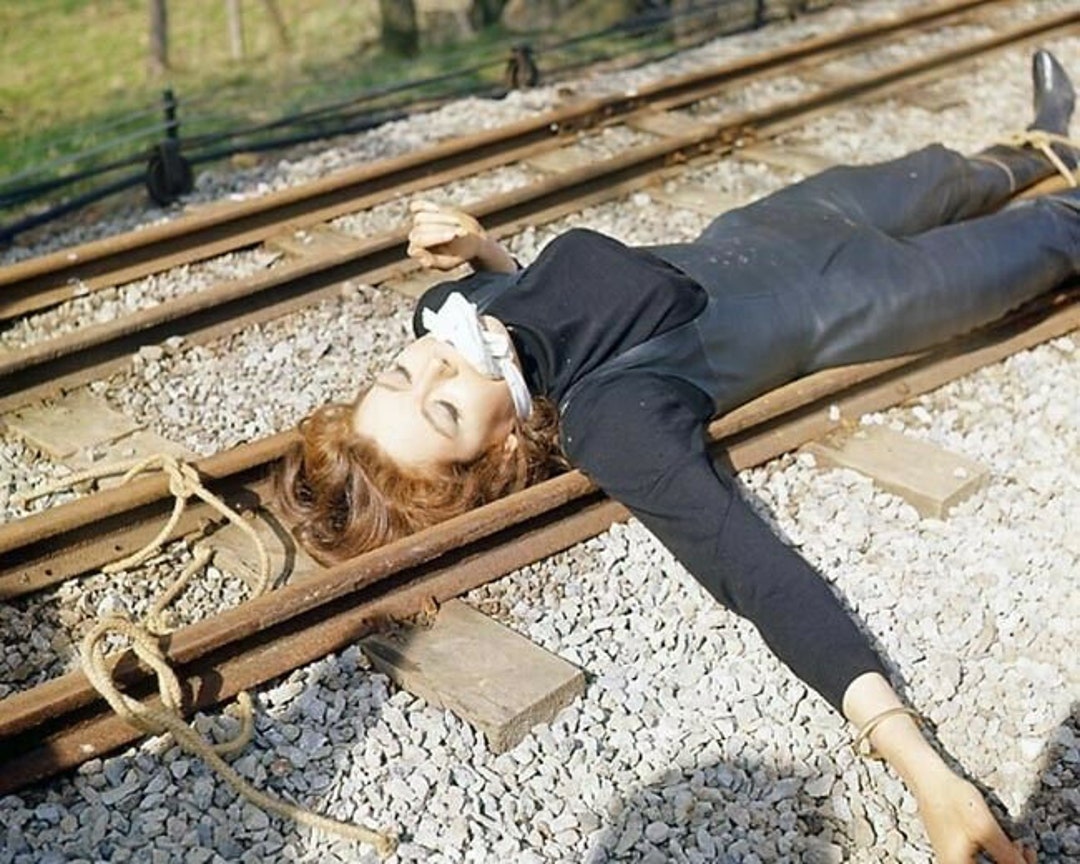 Diana Rigg as Mrs Peel Bound and Gagged and Tied to Train Tracks Cult
