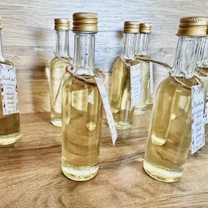 ”that’s Amore” bridal shower olive oil favors in a clear glass bottle with gold lid