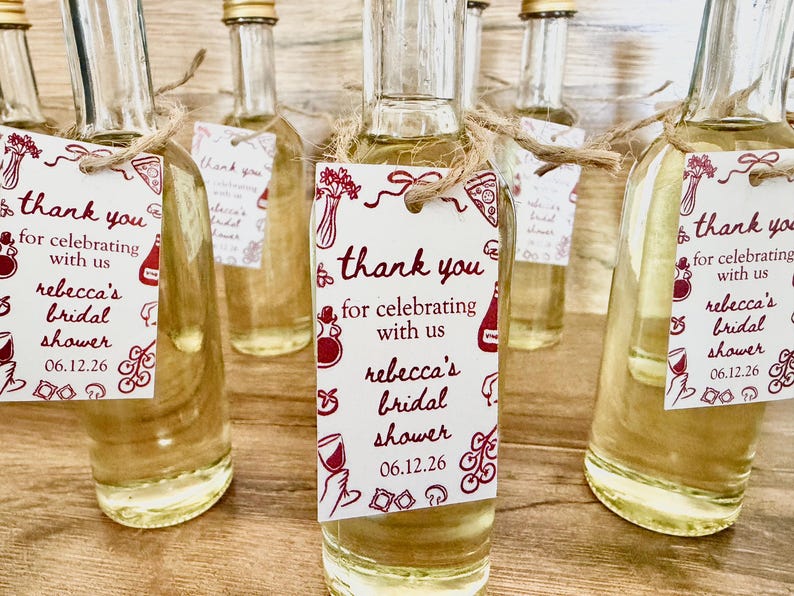 ”that’s Amore” bridal shower olive oil favors in a clear glass bottle with gold lid
