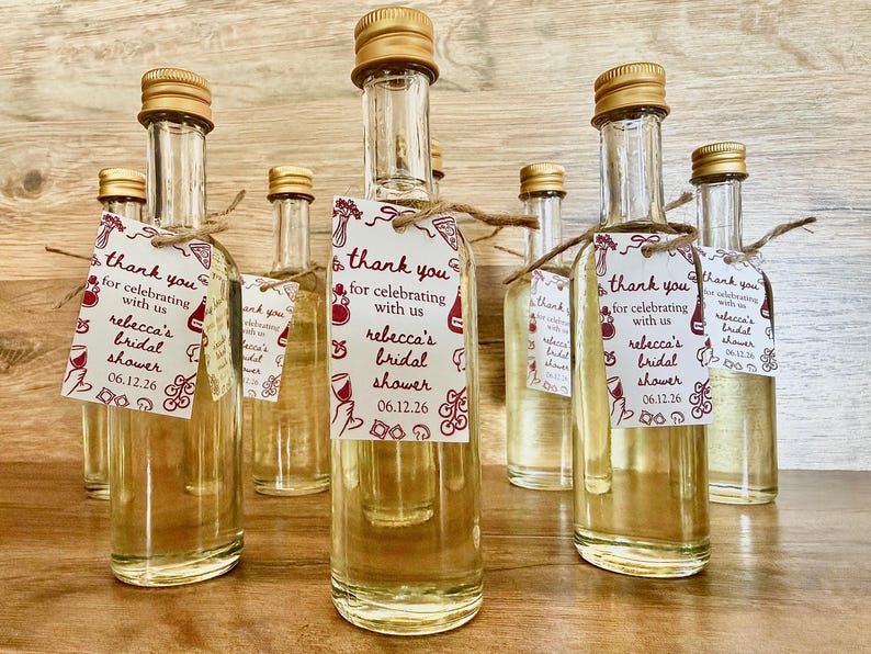 ”that’s Amore” bridal shower olive oil favors in a clear glass bottle with gold lid