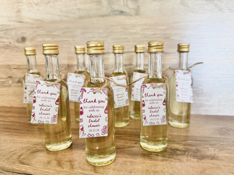 ”that’s Amore” bridal shower olive oil favors in a clear glass bottle with gold lid