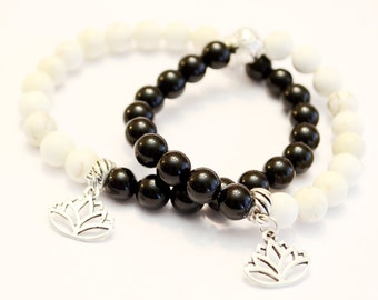 Lotus Flower - A pair of Black and White bracelets - For couples/friends - Black Agate and Howlite Bead Bracelets with Silver Plated Charms