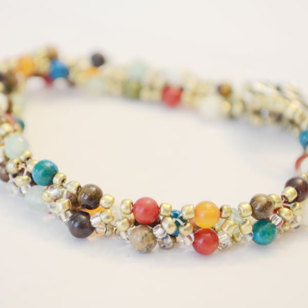 Colourful beaded bracelet made with assorted semi-precious stones beaded bracelet decorated with metal rose button