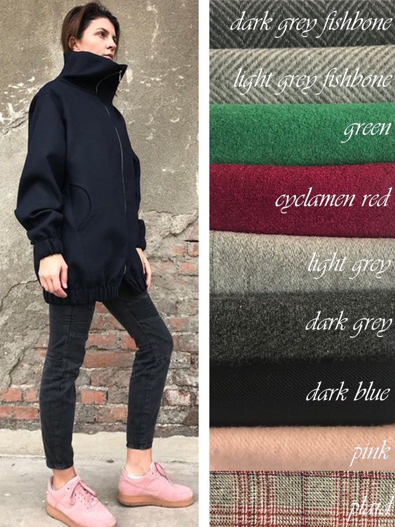 May include: A navy blue mock neck jacket with a zipper closure. The jacket is shown with black jeans and pink sneakers. The image also shows swatches of fabric in various colors and patterns, including dark grey fishbone, light grey fishbone, green, cyclamen red, light grey, dark grey, dark blue, pink, and plaid.