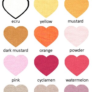 May include: A color chart with 12 heart-shaped fabric swatches. The swatches are labeled with the following colors: ecru, yellow, mustard, dark mustard, orange, powder, pink, cyclamen, watermelon, beige, cappuccino, and rose ash.