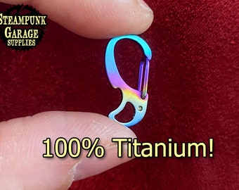 May include: A rainbow-colored titanium carabiner clip. 100% Titanium!
