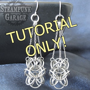 May include: A pair of silver earrings with a chain and a decorative knot at the bottom. The earrings are labelled "TUTORIAL ONLY!"