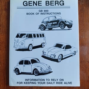 May include: A white instruction manual titled "GENE BERG" with illustrations of classic cars. The manual includes the text "GB 800 BOOK OF INSTRUCTIONS" and the tagline "INFORMATION TO RELY ON FOR KEEPING YOUR DAILY RIDE ALIVE."