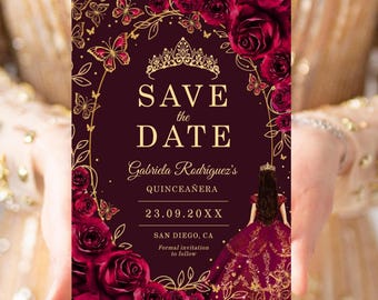 May include: A rectangular Save the Date card in deep burgundy with gold foil accents. It features a tiara, butterflies, and roses. The text reads: Save the Date, Gabriela Rodríguez's Quinceañera, 23.09.20XX, San Diego, CA, Formal invitation to follow.