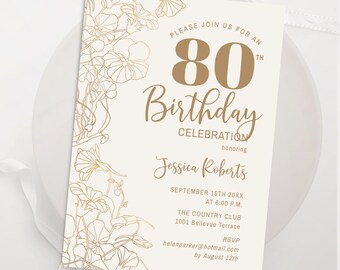 May include: An ivory-colored 80th birthday invitation with gold floral accents. The invitation includes the text "Please join us for an 80th Birthday Celebration honoring Jessica Roberts" and event details.