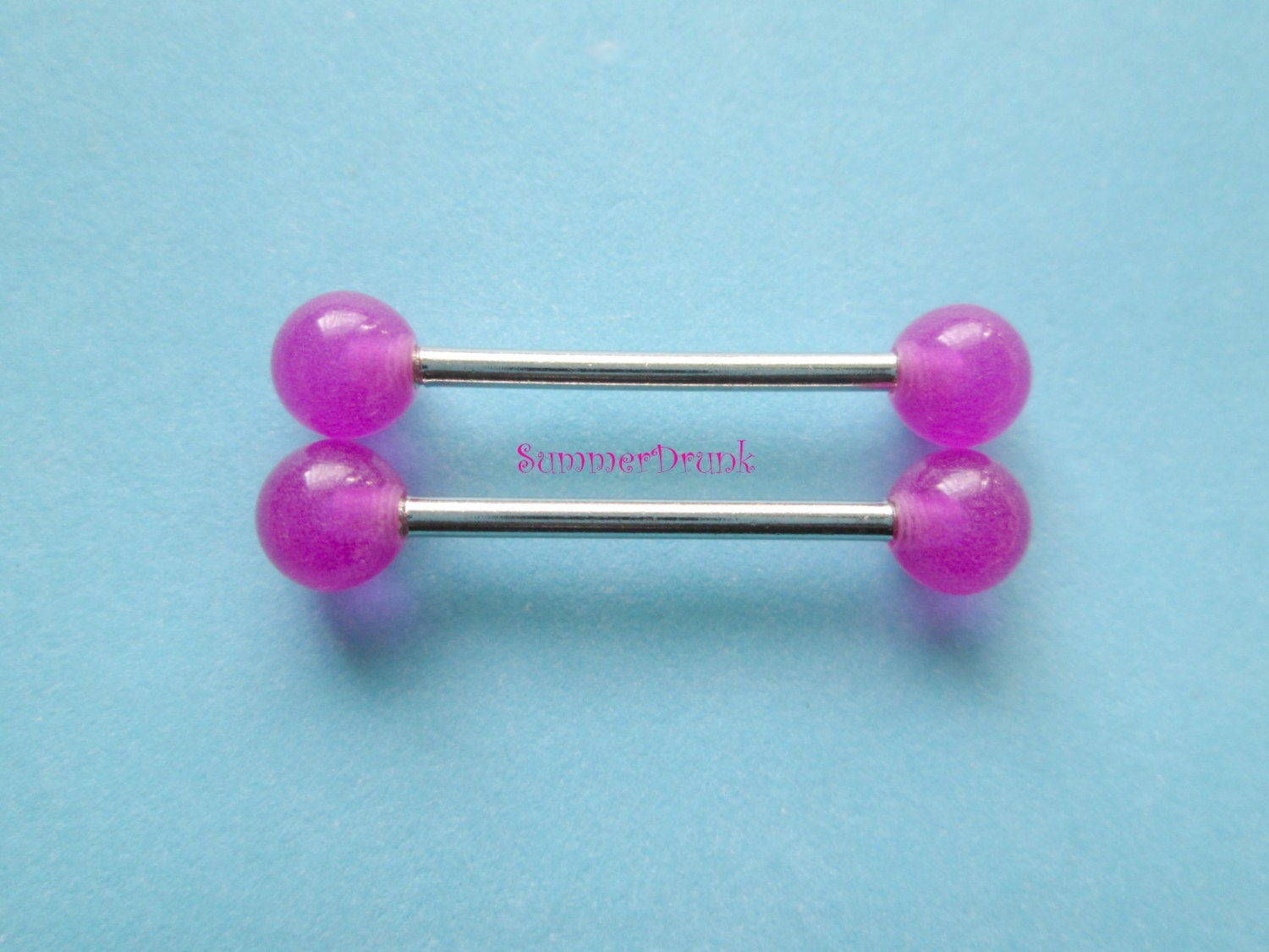 Piercing nipple with balls glow in the dark Piercing nipple with balls glow in the dark