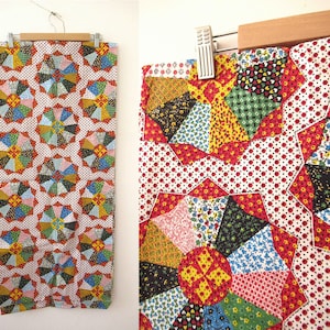 May include: A rectangular fabric piece featuring a repeating pattern of multi-colored, star-shaped floral motifs. The design consists of various small-scale prints in red, yellow, blue, green, and black, set against a white background with red dots.