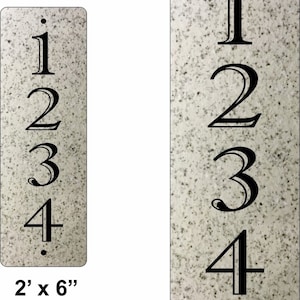 May include: Two vertical house number signs with black numbers 1, 2, 3, and 4 on a white background with a speckled texture. The smaller sign is 2 inches by 6 inches and the larger sign is 3 inches by 9 inches.