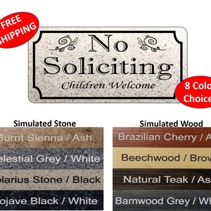 May include: A doormat with the text "No Soliciting" and "Children Welcome" in black lettering on a simulated stone background. The doormat is available in eight different color choices, including Burnt Sienna / Ash, Celestial Grey / White, Solarius Stone / Black, Mojave Black / White, Brazilian Cherry / Ash, Beechwood / Brown, Natural Teak / Ash, and Barnwood Grey / White.