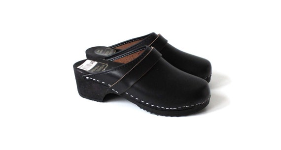 black wooden clogs