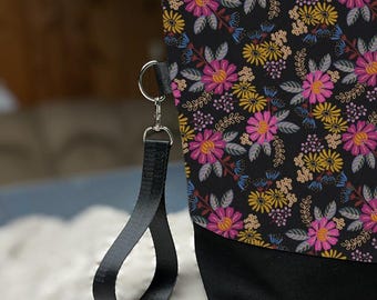 Medium sized knitting bag in black floral print for light sweaters, shawls or other multi-skein projects