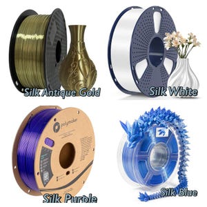 May include: Four spools of filament for 3D printing. The spools are labeled "Silk Antique Gold", "Silk White", "Silk Purple", and "Silk Blue".
