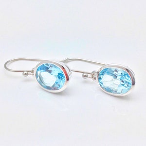 Blue Topaz Earrings // Rhodium Finished 925 Sterling Silver // Oval Setting // Hook Wires