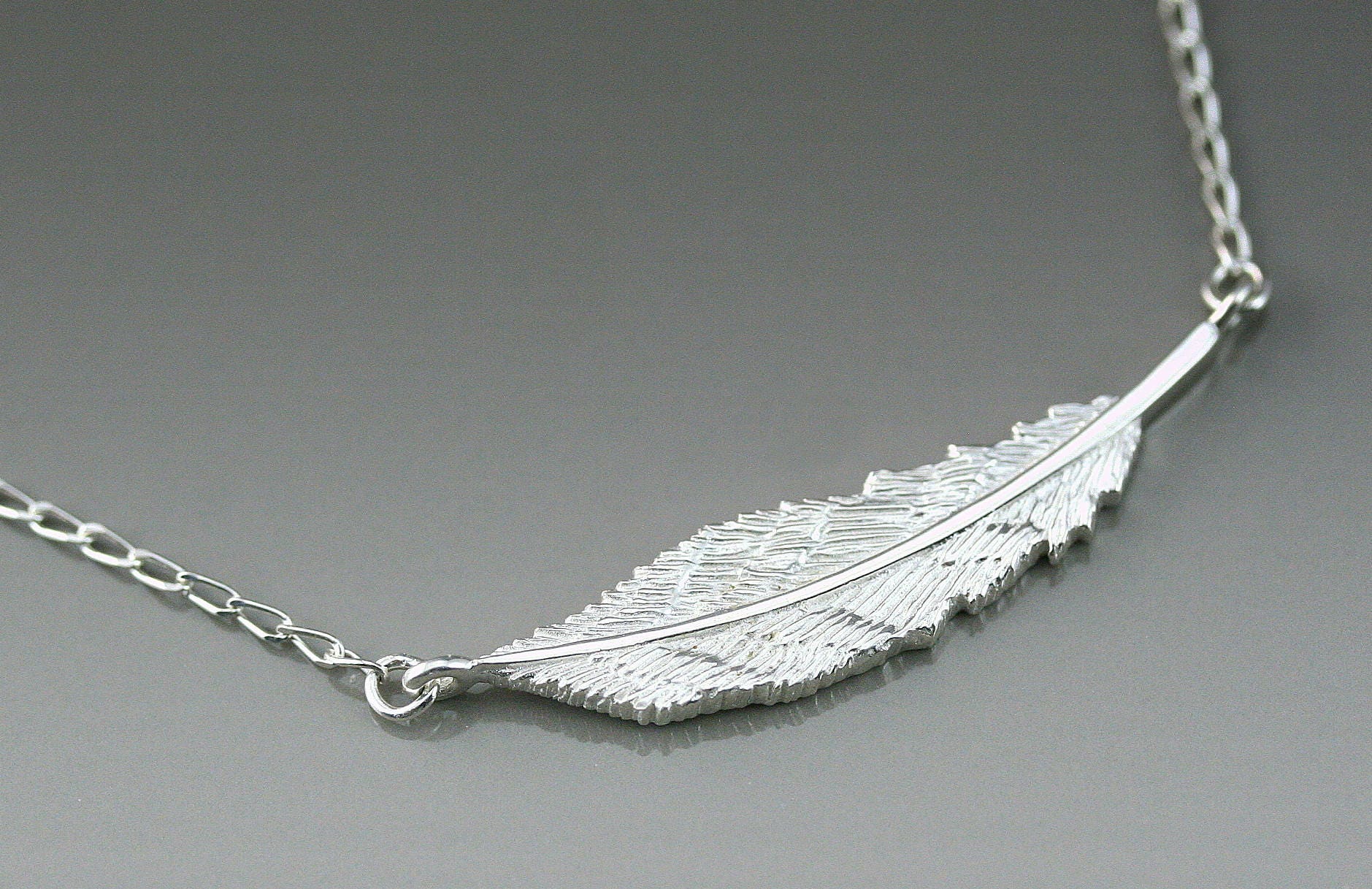 Sideways feather necklace discount
