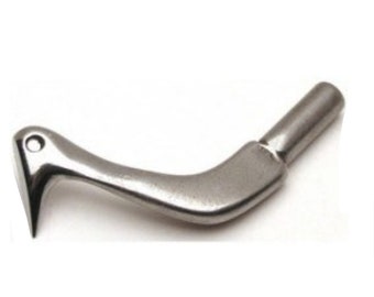 May include: A silver-colored, curved metal tool with a pointed end and a cylindrical handle. The tool has a small hole near the pointed end and a smooth, polished finish. The design suggests a specialized function.