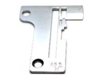 May include: Silver sewing machine needle plate with a slot for the needle and a hole for the bobbin. The plate has the number 355 printed on it.
