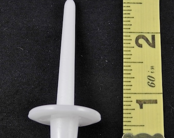 May include: White plastic cake decorating tip with a round base and a long, thin, pointed tip. The tip is about 2 inches long.