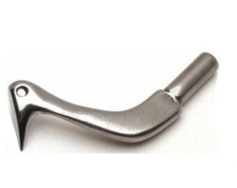 May include: A silver-colored, curved metal tool with a pointed end and a cylindrical handle. The tool has a small hole near the pointed end and a smooth, polished finish. The design suggests a specialized function.