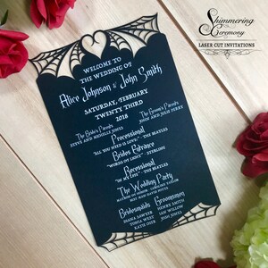 May include: Black laser-cut wedding invitation with a spiderweb design. The invitation features the text "Welcome to the Wedding of Alice Johnson & John Smith" and the date "Saturday, February Twenty Third, 2018".