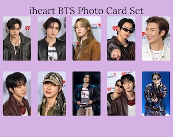 May include: A set of ten rectangular photo cards titled iheart BTS Photo Card Set, featuring individual and group portraits of the members of the music group BTS. The images show the members in various outfits, including leather jackets and sunglasses.