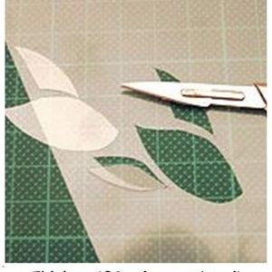 May include: A close-up of a 190 micron stencil sheet with a leaf design. A craft knife is used to cut out the design. Thicker 190 micron stencil sheets for all our stencils.