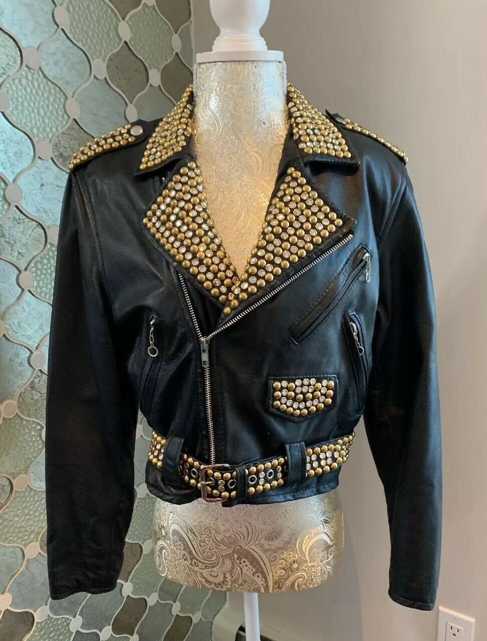 black leather jacket with gold studs