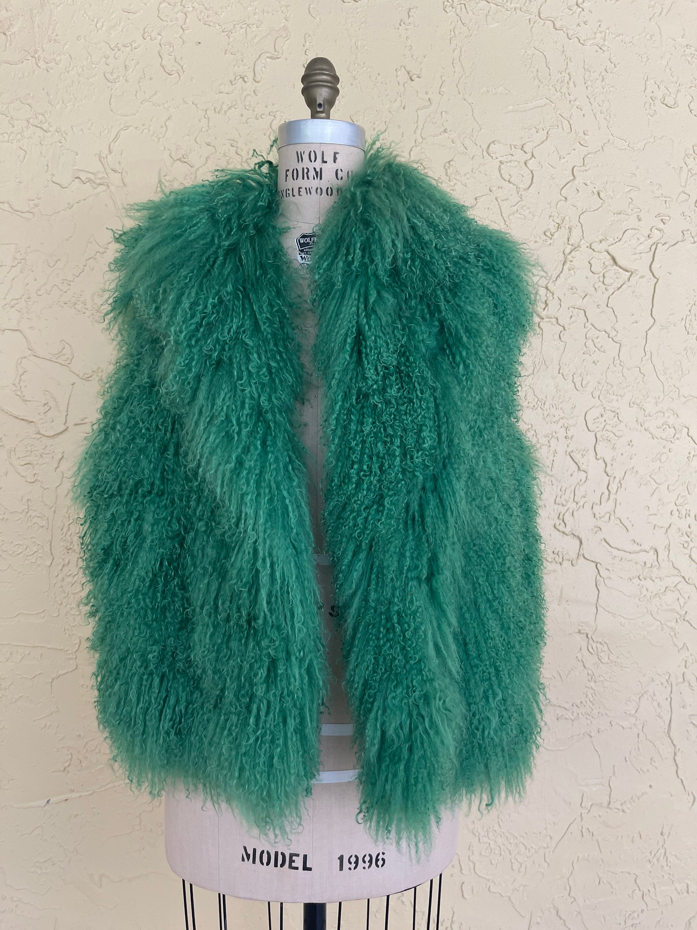 green fuzzy vest
