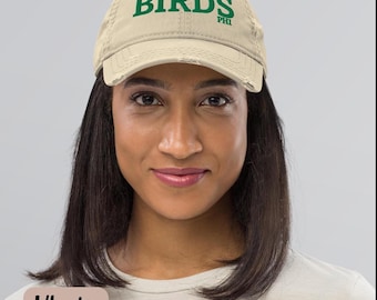 May include: A khaki distressed baseball cap with green embroidery that reads "BIRDS PHIL".