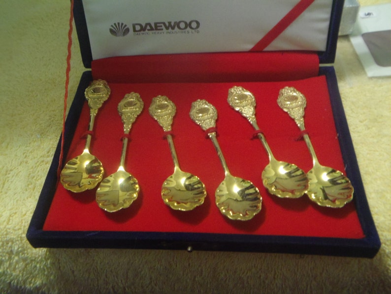 Vintage Daewoo Heavy Industries Gold Tone Collectible Spoon Set