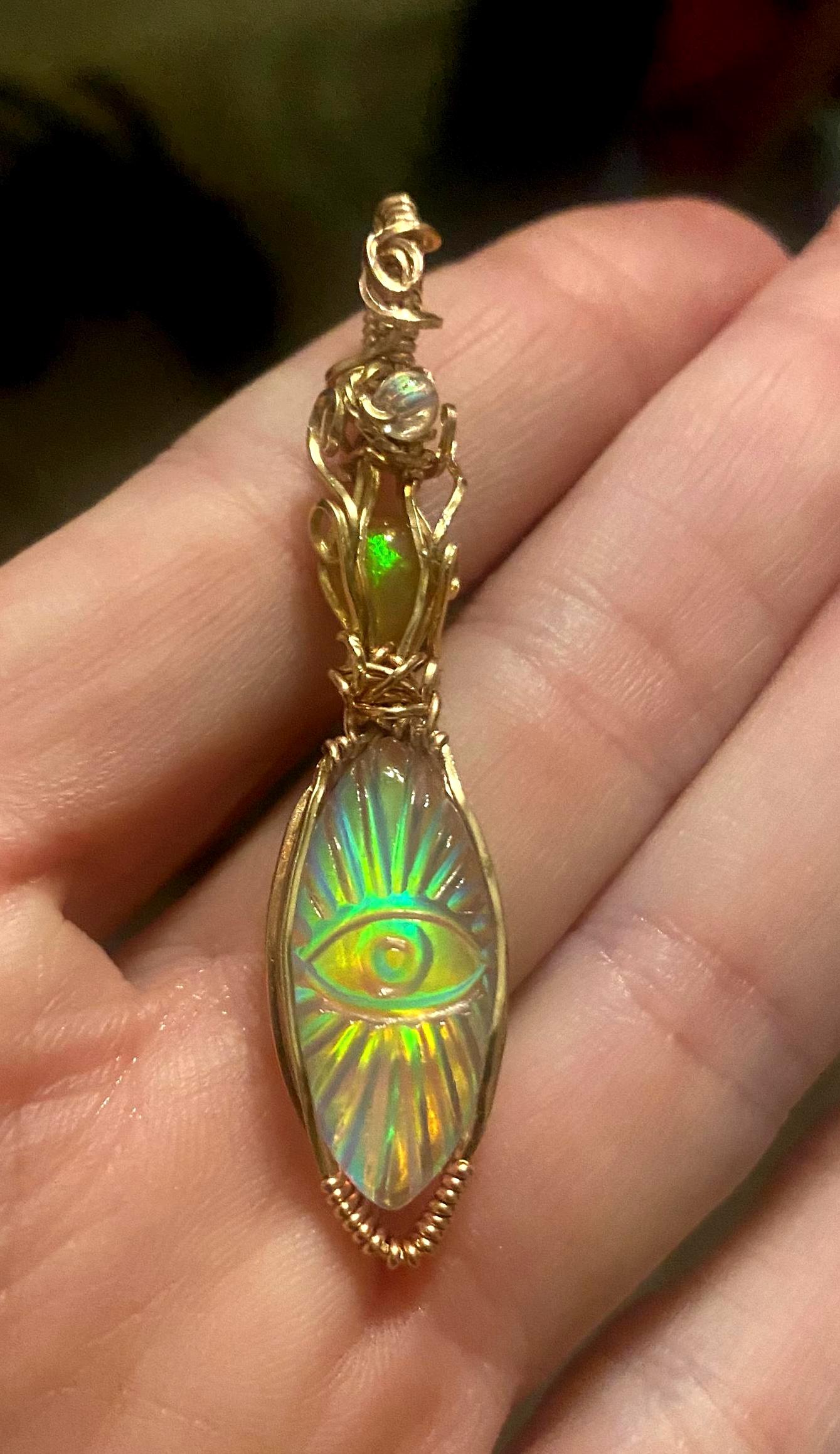 Stunning Aurora Opal eye with a matching Ethiopian Opal/14K gold filled wire.