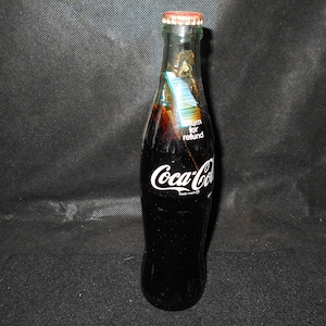 Unopened 10 oz. Coca Cola with Peanut Wrapper Inside