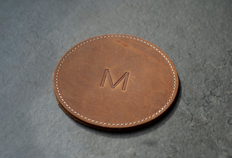 handcrafted leather coasters in a warm honey hue, perfect for protecting surfaces and adding a touch of personalized rustic elegance to your decor.