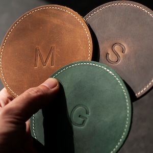 Sophisticated customized genuine leather coasters , ideal for elevating any coffee table or bar cart. Durable and stylish, these coasters add a touch of luxury to your everyday life.