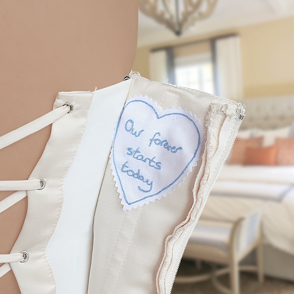 Custom handwriting embroidered on a wedding dress label. Personalised something blue for bride. Wedding memorial gift for bride from mother