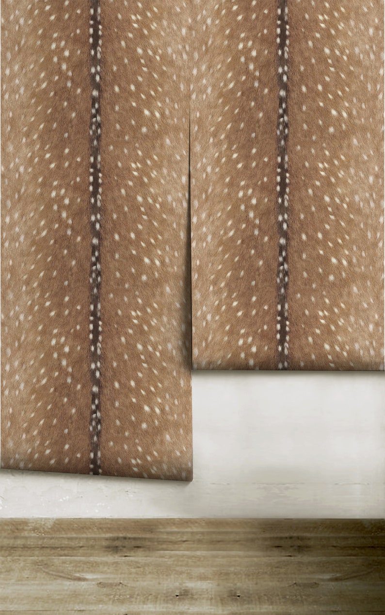 May include: Two pieces of brown and white patterned wallpaper with a dark brown stripe down the center of each piece. The wallpaper is rolled up and the edges are visible.