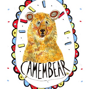 May include: A whimsical illustration of a brown bear with the word "Camembear" written below it. The bear is surrounded by a colorful border with red, yellow, blue, and gold accents.